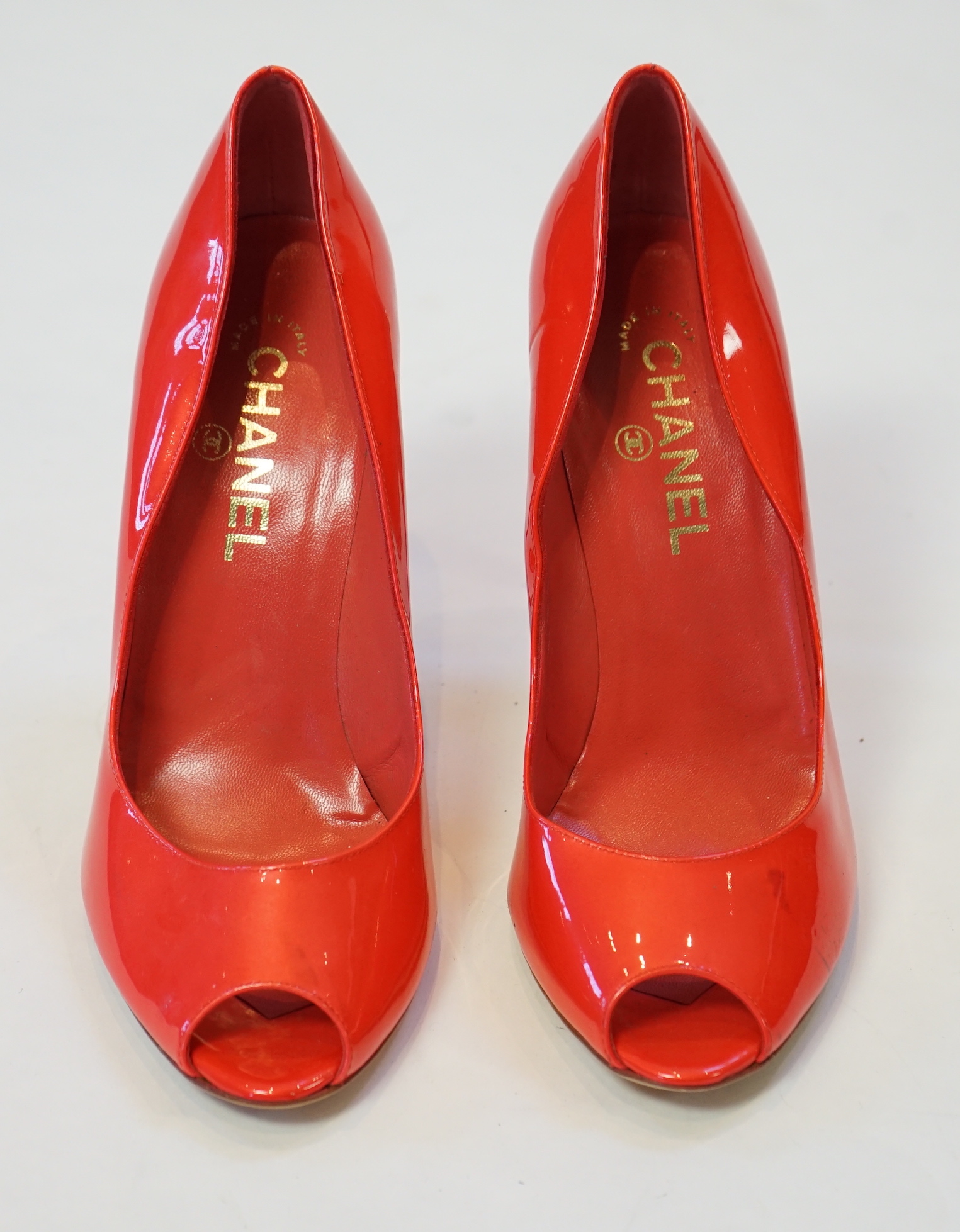 A pair of Chanel lady's metallic coral peep toe patent leather heels, size EU 39.5